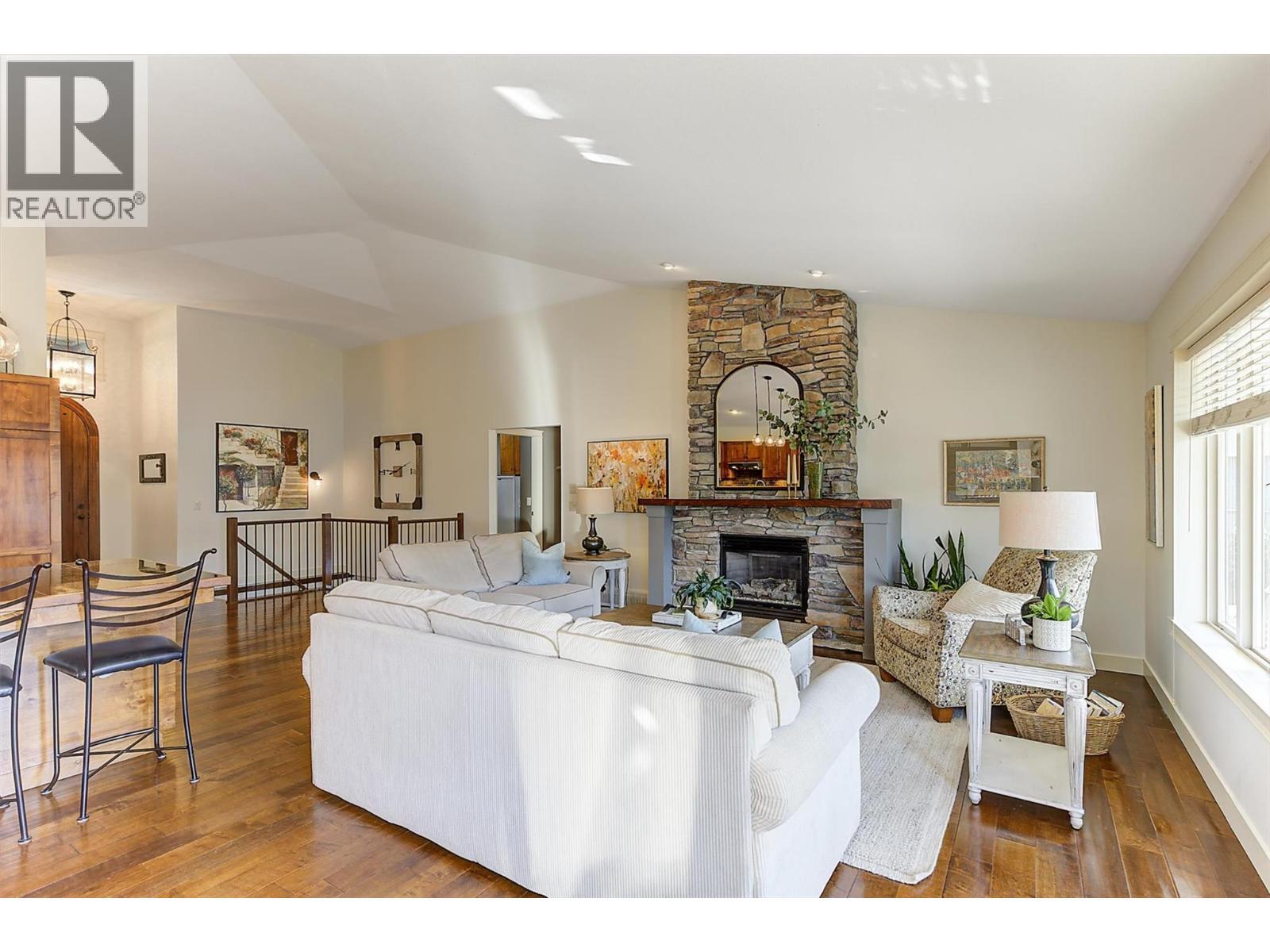 12931 East Ridge Drive, Lake Country, BC - Indoor Photo Showing Living Room With Fireplace