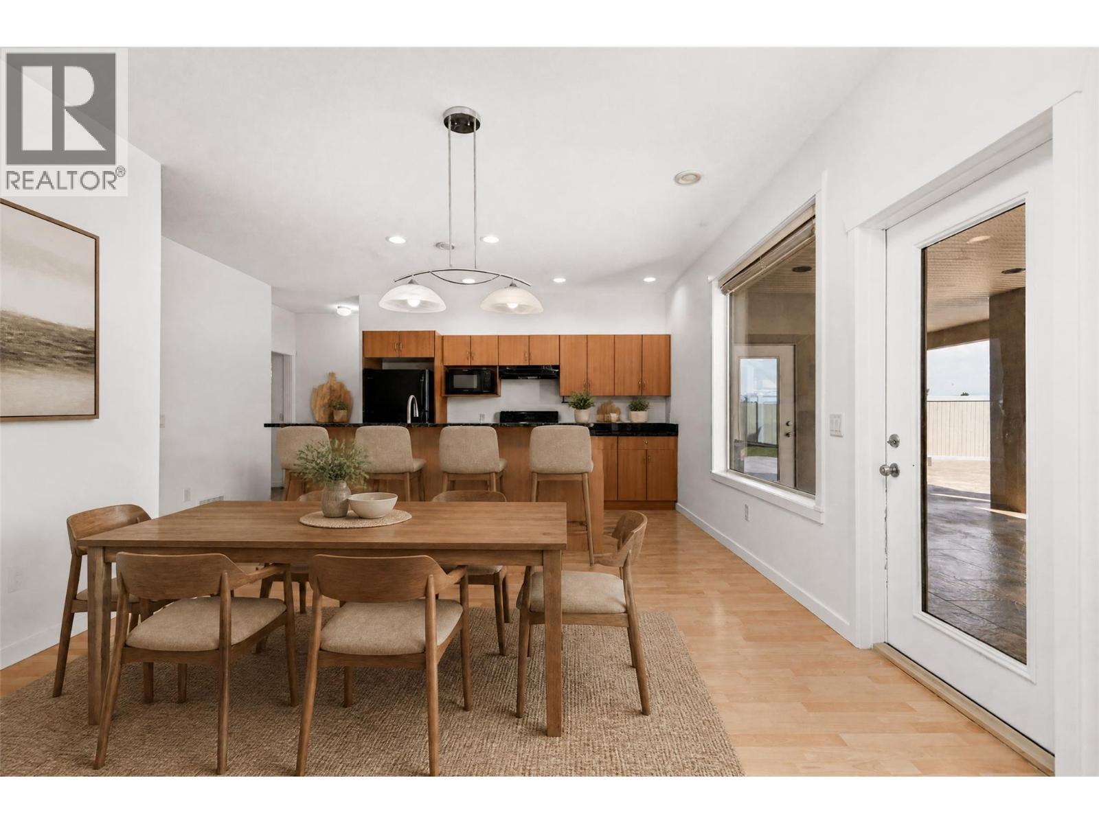 Lower Dining - virtually staged - 1581 Gregory Road, West Kelowna, BC - Indoor Photo Showing Dining Room