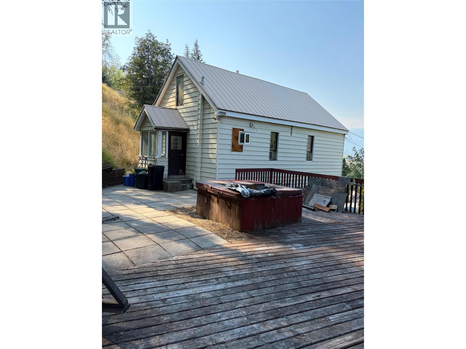 main entrance with expansive patio - 626 Hendry Street, Trail, BC - Outdoor With Deck Patio Veranda