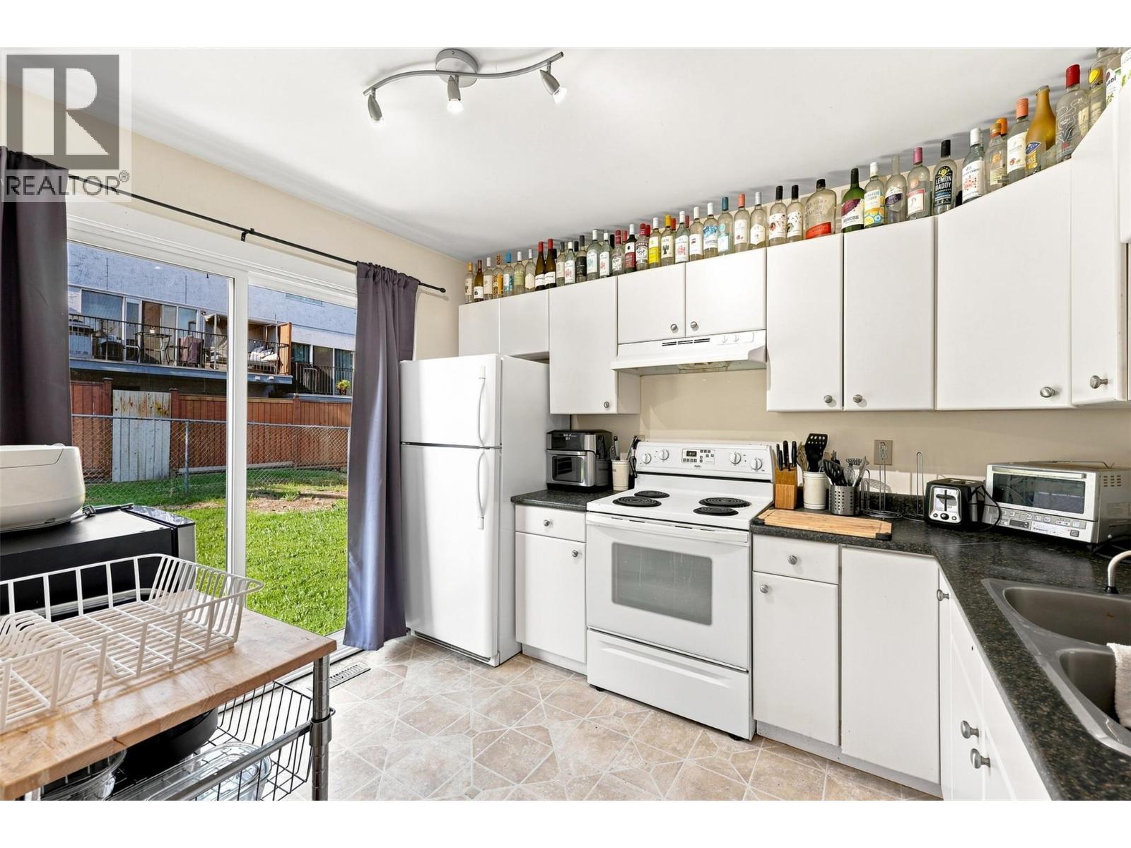 643 Mcbeth Place Unit# 106, Kamloops, BC - Indoor Photo Showing Kitchen With Double Sink