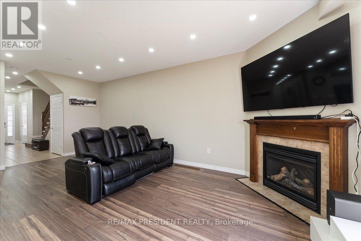 285 Southbrook Drive, Hamilton, ON - Indoor Photo Showing Living Room With Fireplace