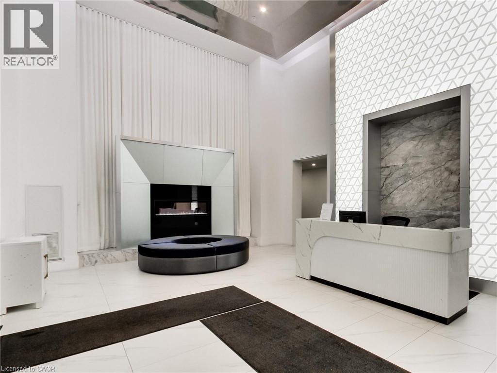 16 Concord Place Unit# 318, Grimsby, ON - Indoor With Fireplace