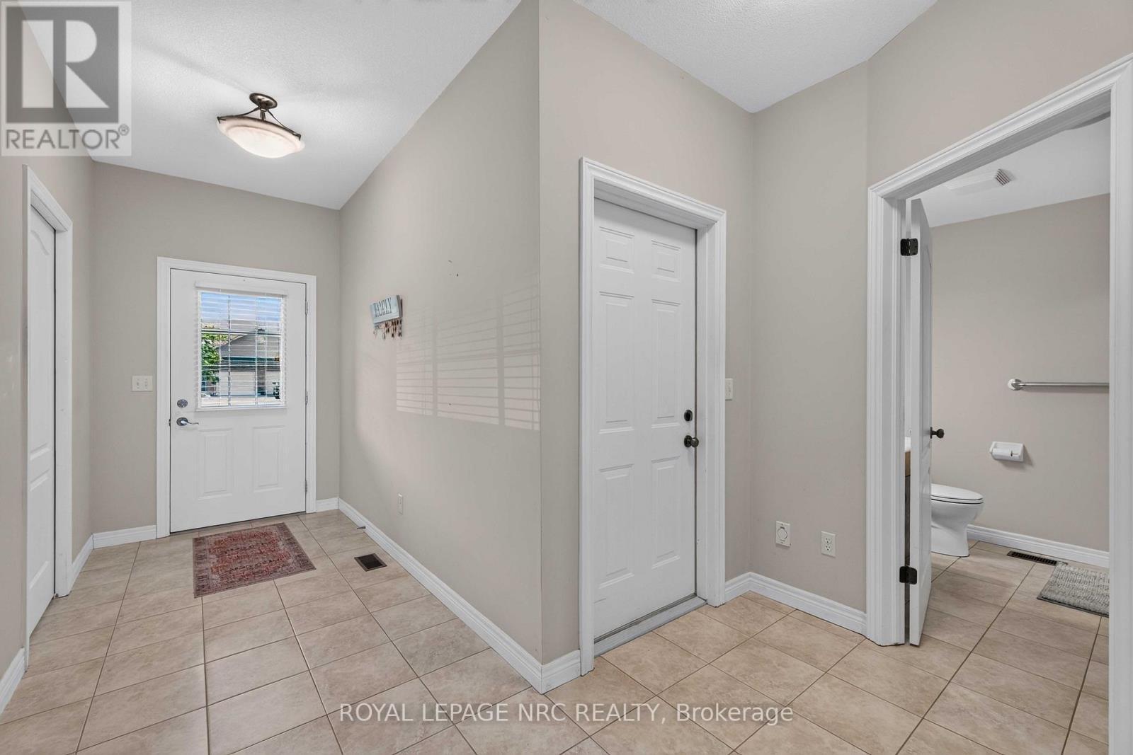 View to Garage Door and Bathroom - 82 Maple Street, Port Colborne (Sugarloaf), ON - Indoor Photo Showing Other Room