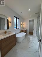 Ensuite Soaker Tub,Double Vanity, access to closet -