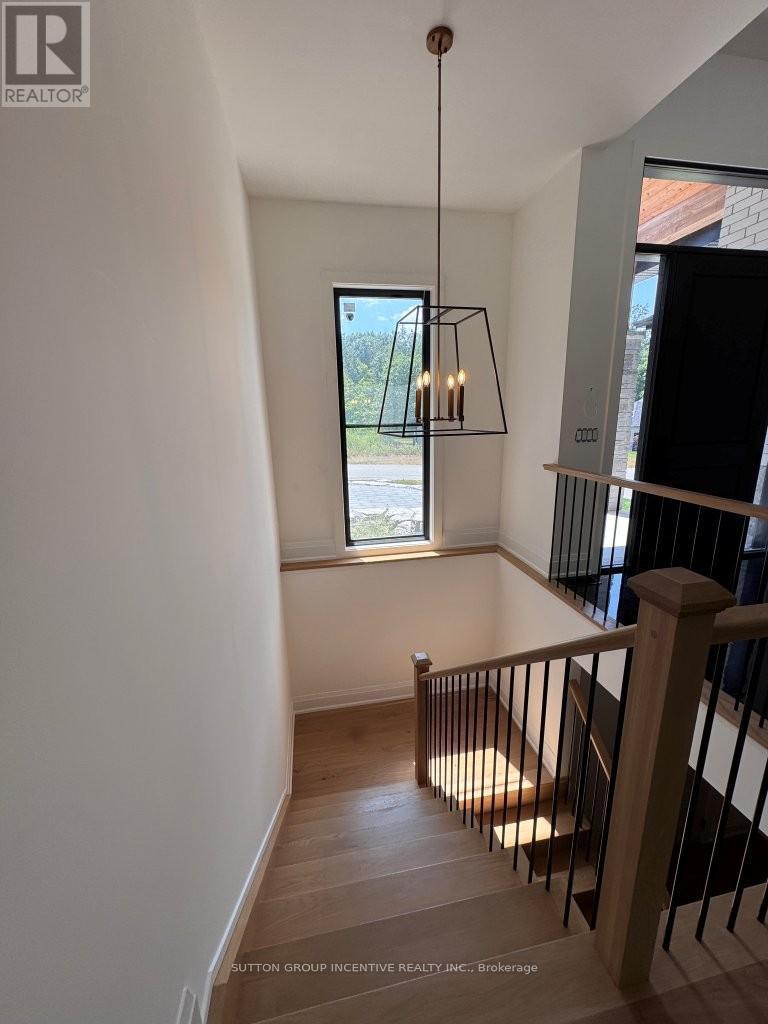 Staircase from Main Floor to Basement - 5 Jean Miller Court, Springwater, ON - Indoor Photo Showing Other Room