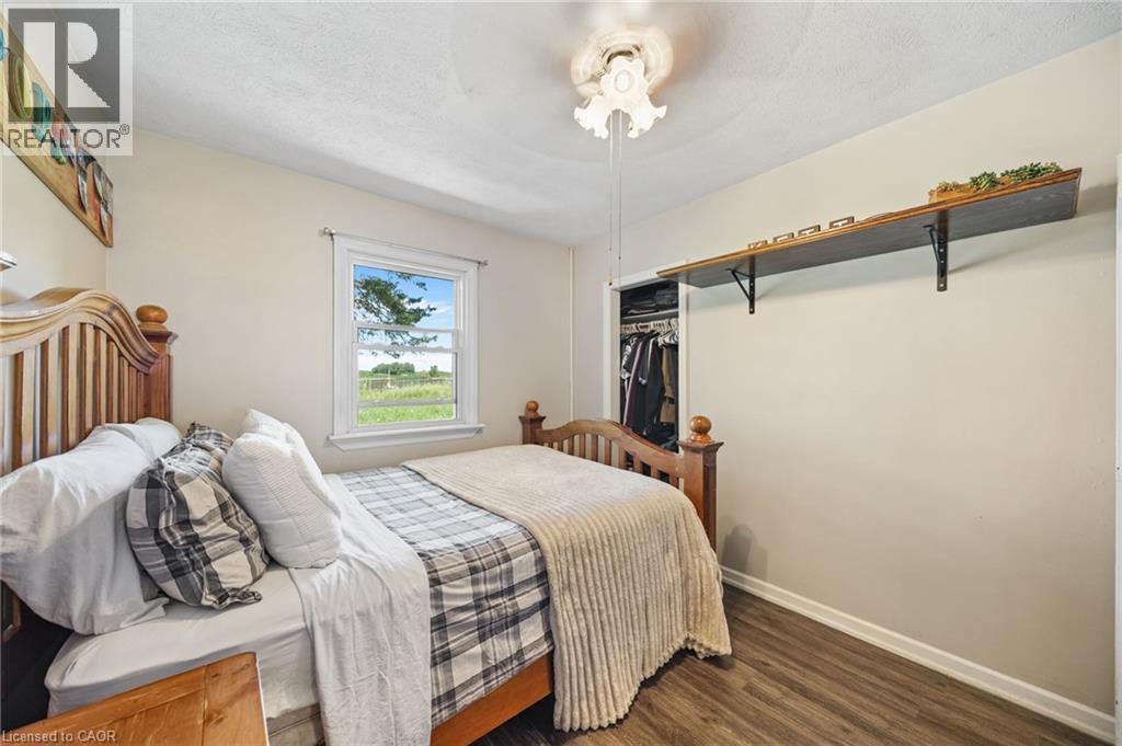 Interior space featuring wood-finish flooring, a double-hung window, and a ceiling fan - 3 Bousfield Lane, Jarvis, ON - Indoor Photo Showing Bedroom