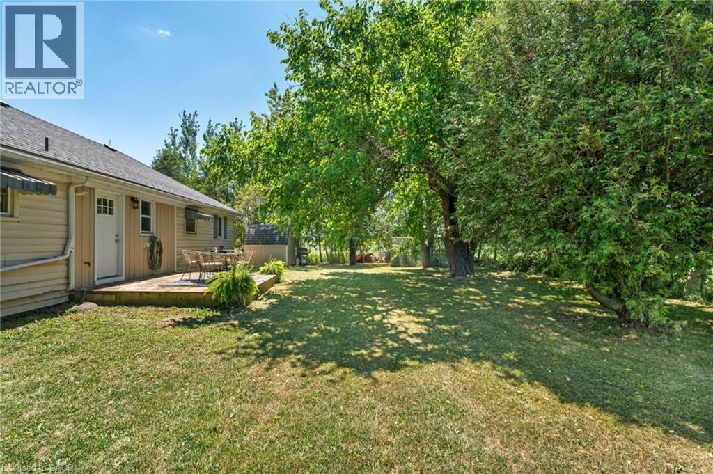 Expansive green lawn with mature trees providing dappled shade - 3 Bousfield Lane, Jarvis, ON - Outdoor