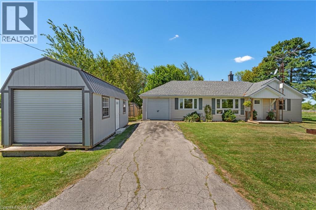 Exterior featuring light-colored siding, a covered front entry, and a prominent front-facing window array - 3 Bousfield Lane, Jarvis, ON - Outdoor