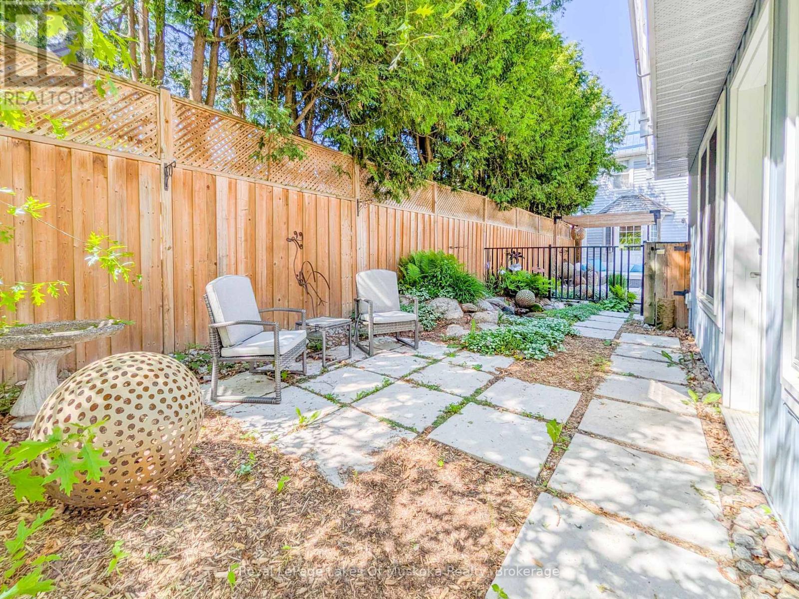 CARRIAGE HS: Patio from Sunroom - 212 James Street, Bracebridge, ON - Outdoor With Deck Patio Veranda