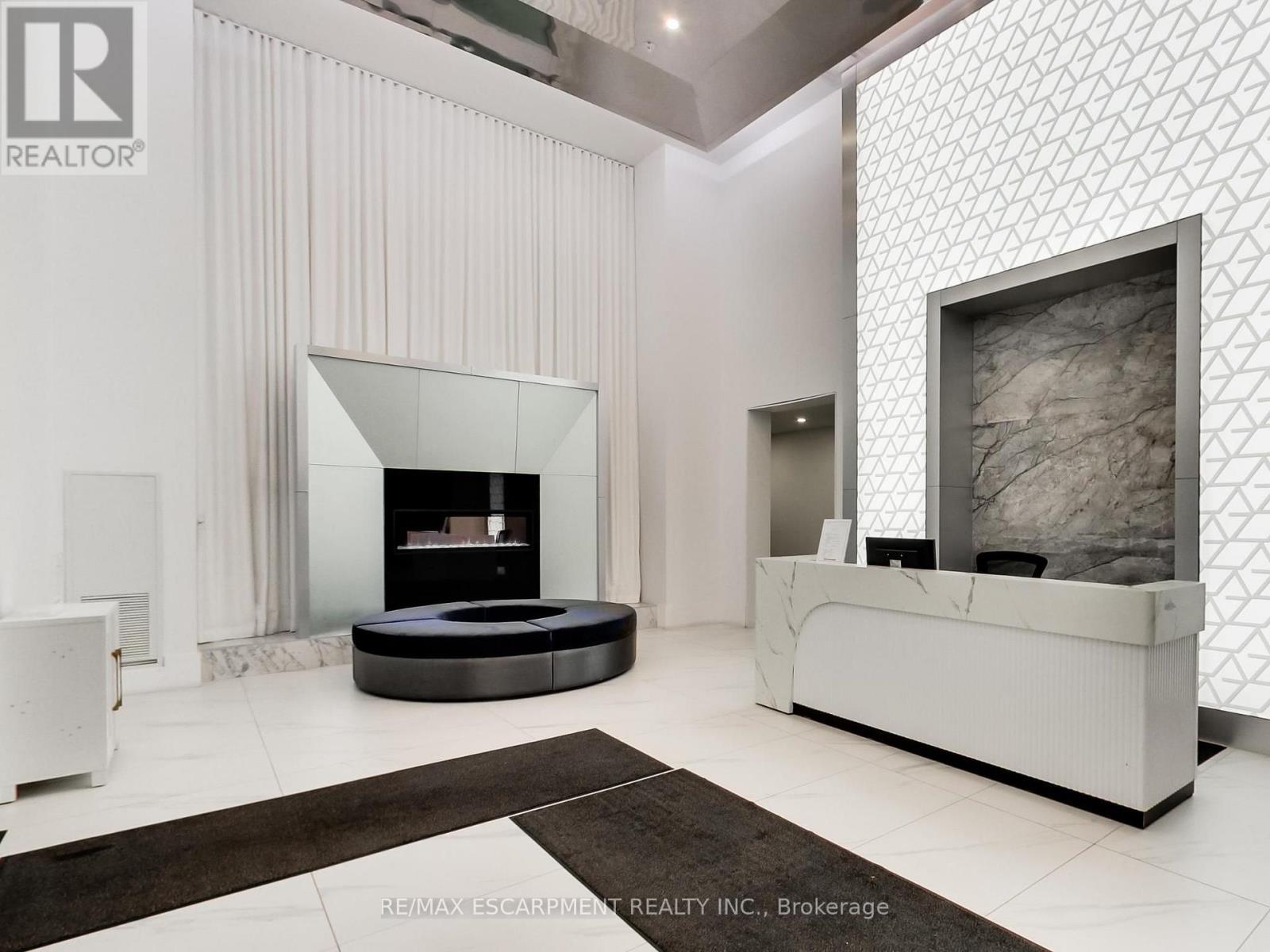 318 - 16 Concord Place, Grimsby, ON - Indoor With Fireplace