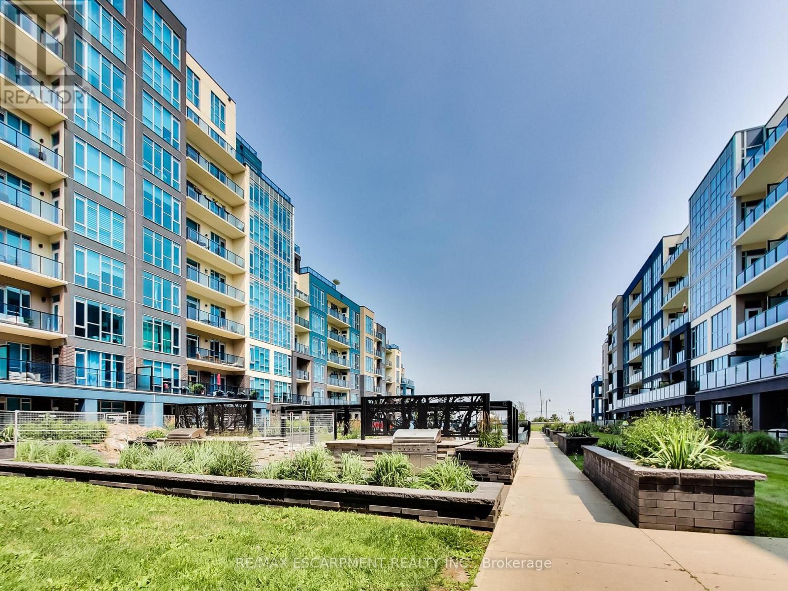 318 - 16 Concord Place, Grimsby, ON - Outdoor With Balcony With Facade