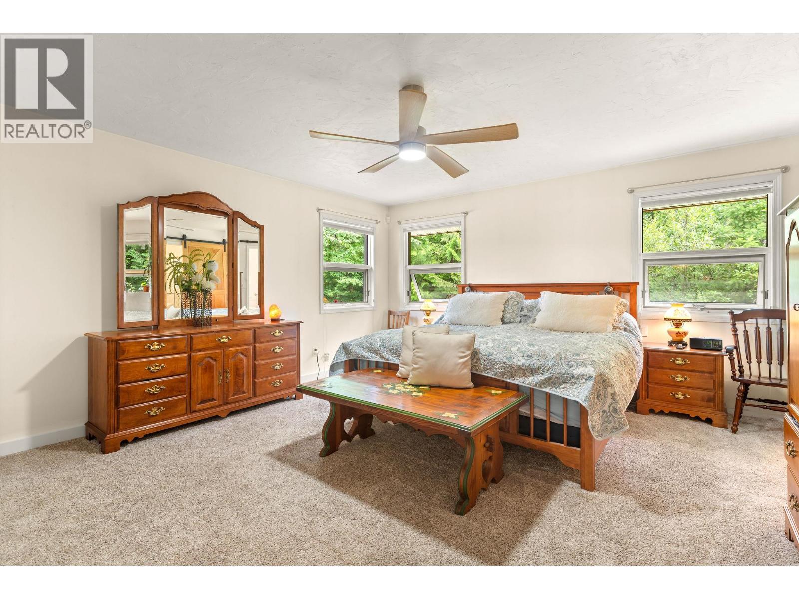 Primary large bedroom main floor - 1587 Pratico Road, Revelstoke, BC - Indoor Photo Showing Bedroom