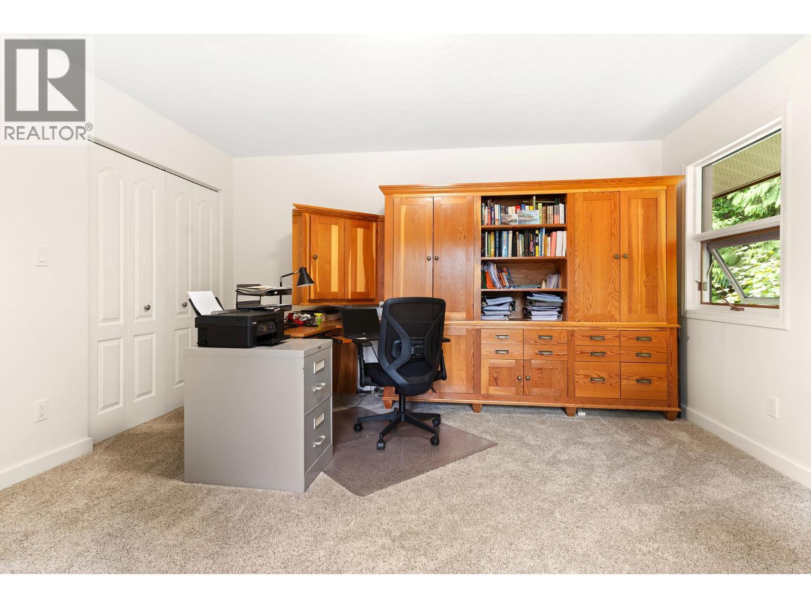 Spare Room main, here as office, large closet - 1587 Pratico Road, Revelstoke, BC - Indoor Photo Showing Office