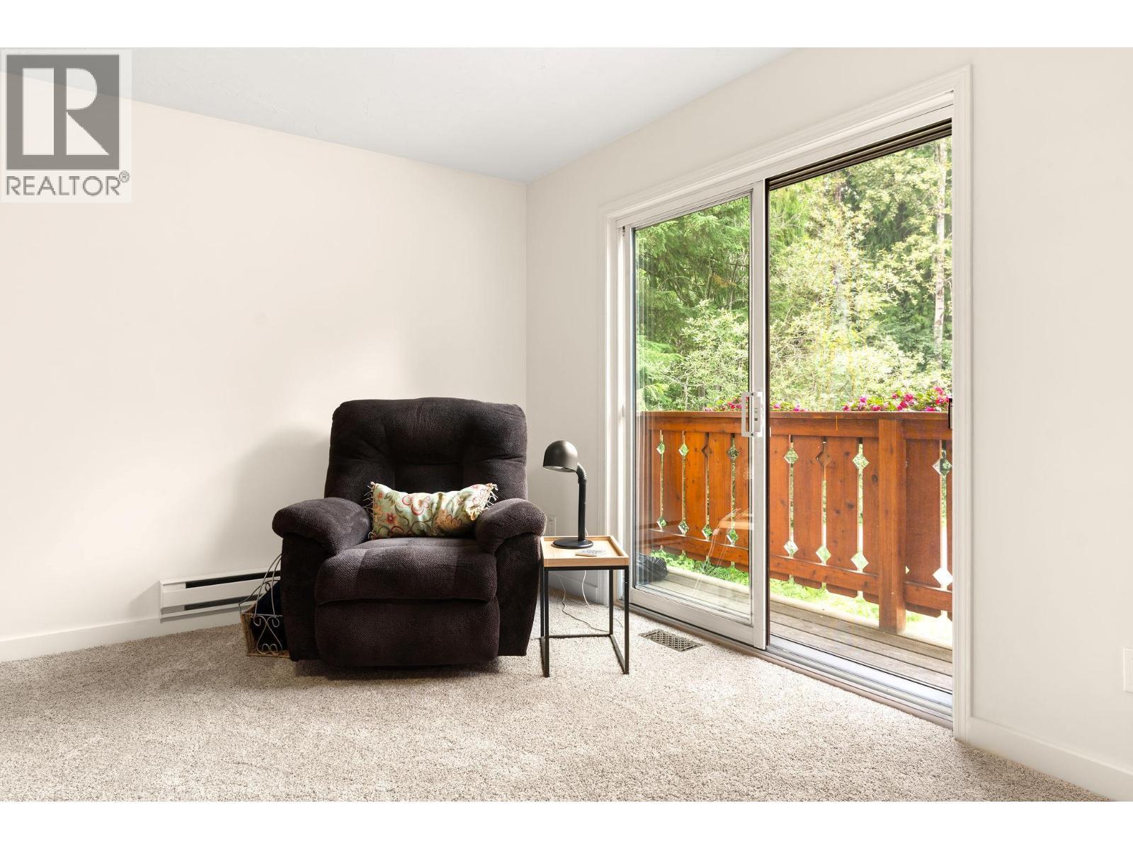 Spare Bedroom main floor with sliding doors - 1587 Pratico Road, Revelstoke, BC - Indoor Photo Showing Other Room
