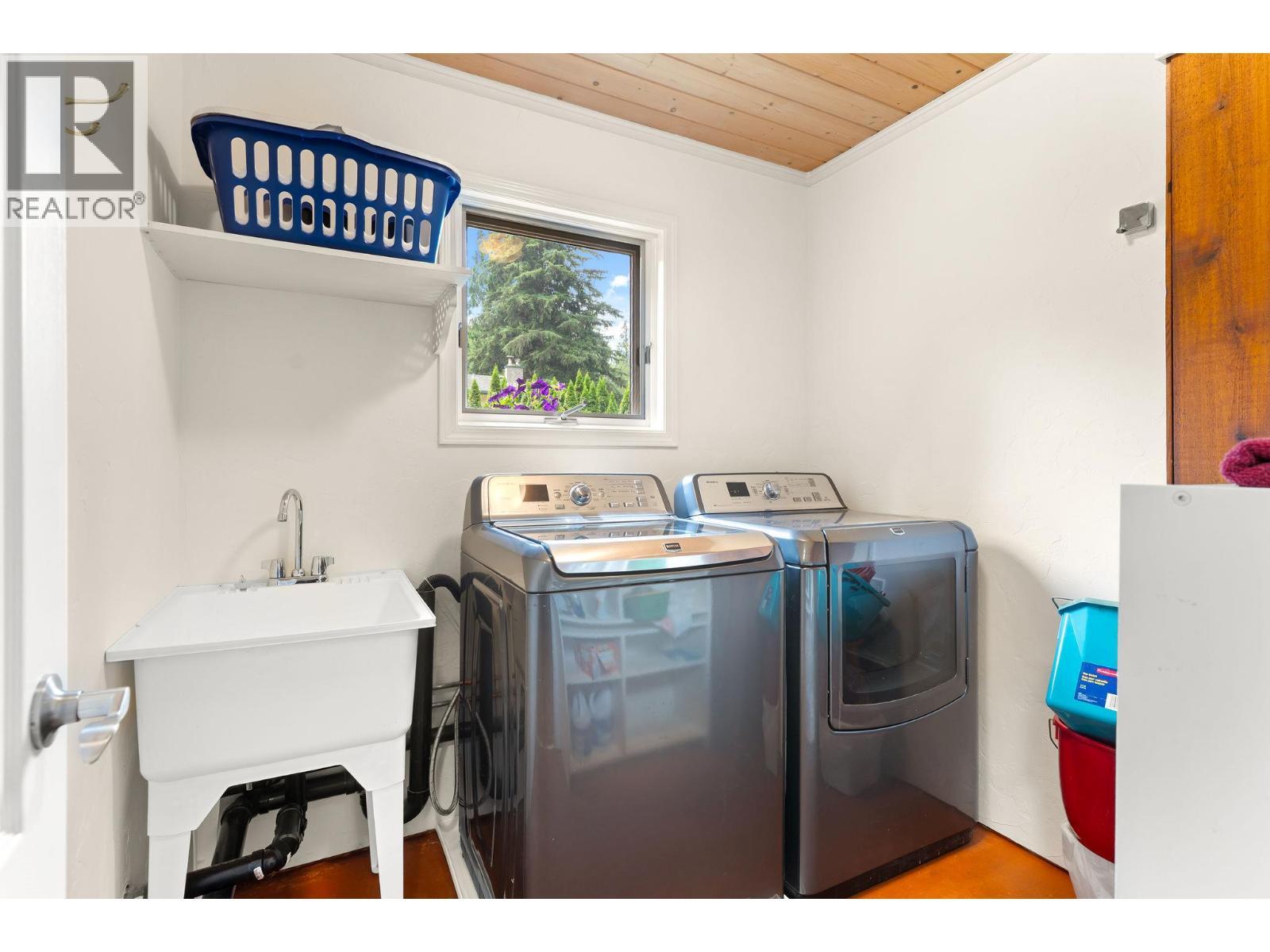 Separate Laundry room in lower level - 1587 Pratico Road, Revelstoke, BC - Indoor Photo Showing Laundry Room