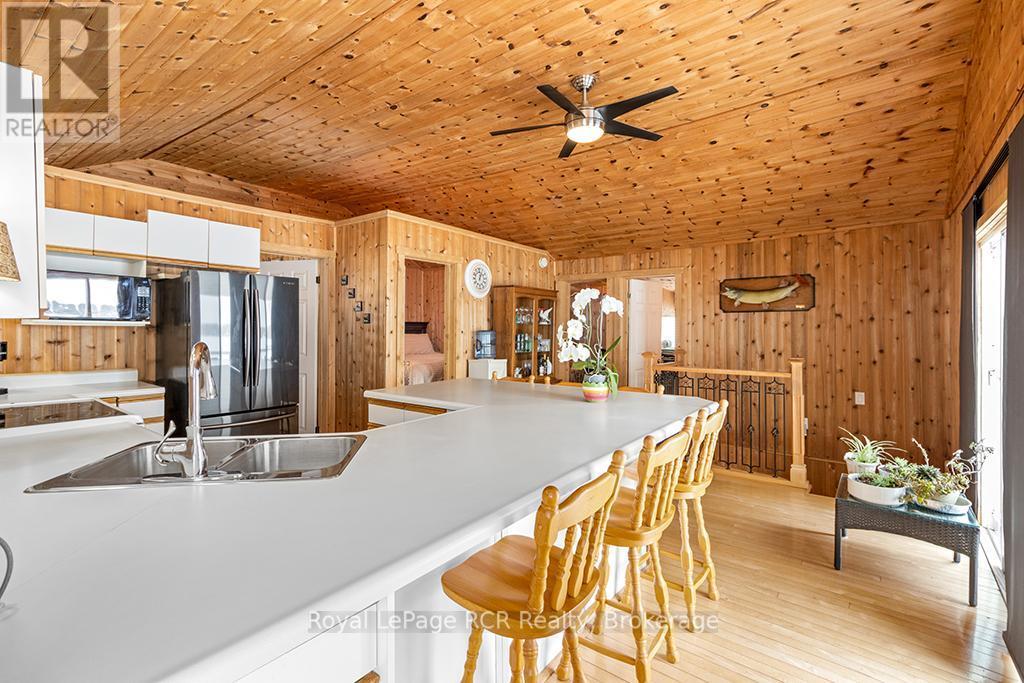 OPEN CONCEPT COTTAGE FEEL - 48 Island View Drive N, South Bruce Peninsula, ON - Indoor Photo Showing Kitchen With Double Sink