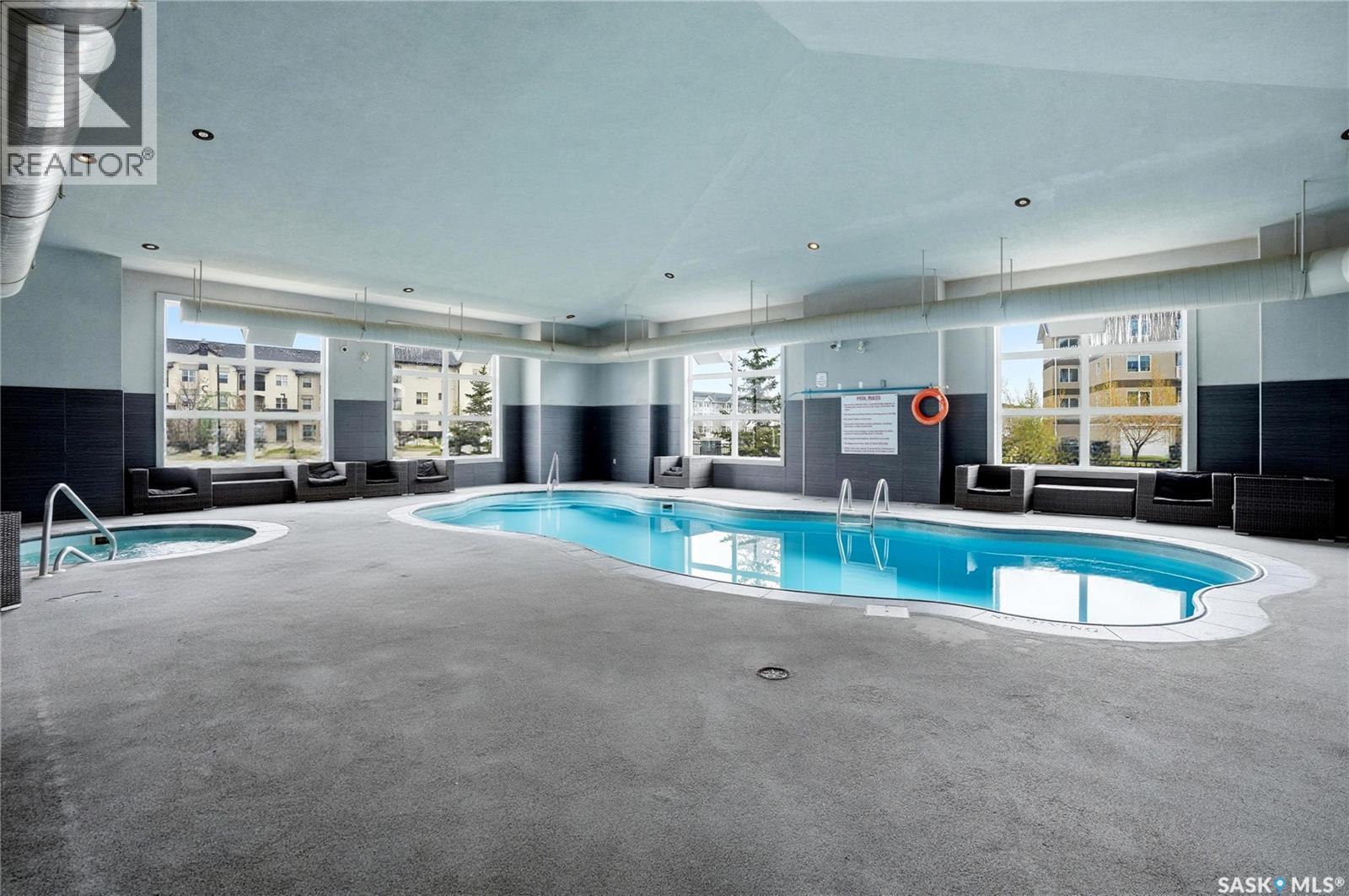 206 1510 Neville Drive, Regina, SK - Indoor Photo Showing Other Room With In Ground Pool
