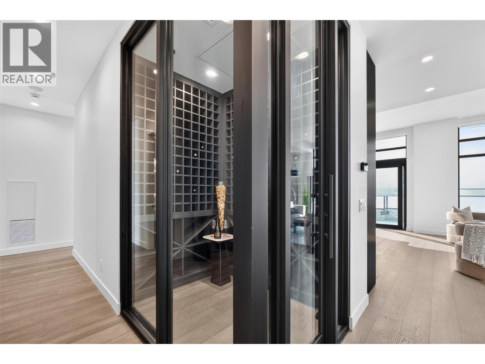 Glass wine cellar with temperature control - 3800 Capozzi Road Unit# Ph2, Kelowna, BC - Indoor Photo Showing Other Room