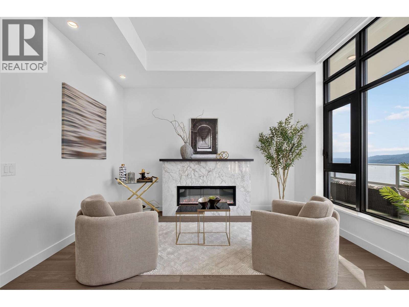 Appealing electric fireplace - 3800 Capozzi Road Unit# Ph2, Kelowna, BC - Indoor Photo Showing Living Room With Fireplace