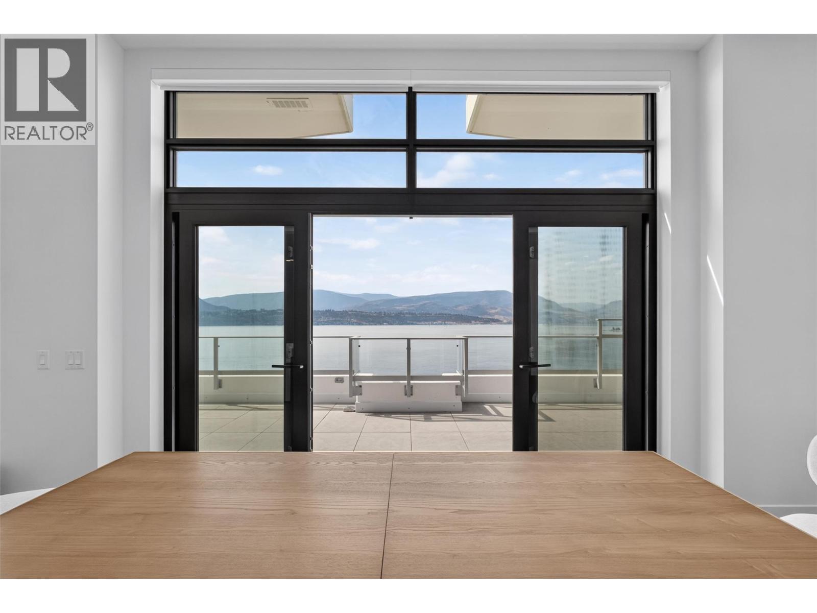 Large sliding doors lead onto the patio - 3800 Capozzi Road Unit# Ph2, Kelowna, BC - Indoor