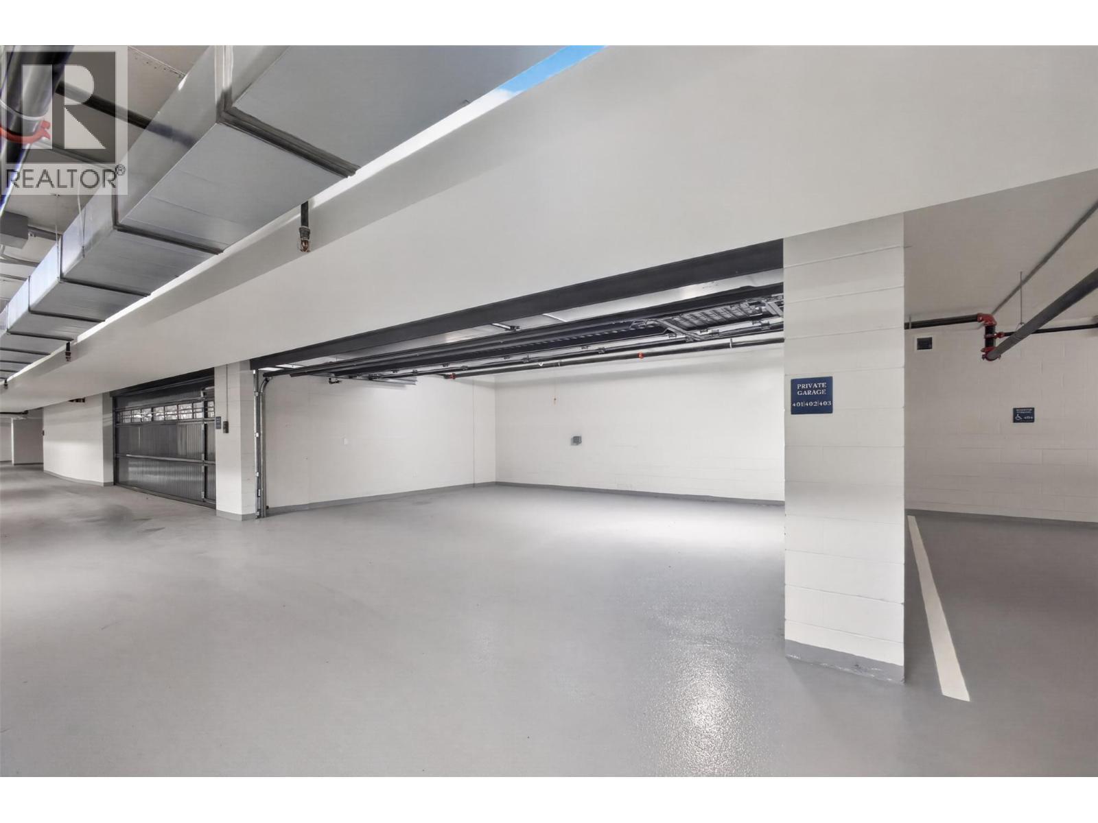 Private triple car garage located on P2 near the elevators - 3800 Capozzi Road Unit# Ph2, Kelowna, BC - Indoor Photo Showing Garage