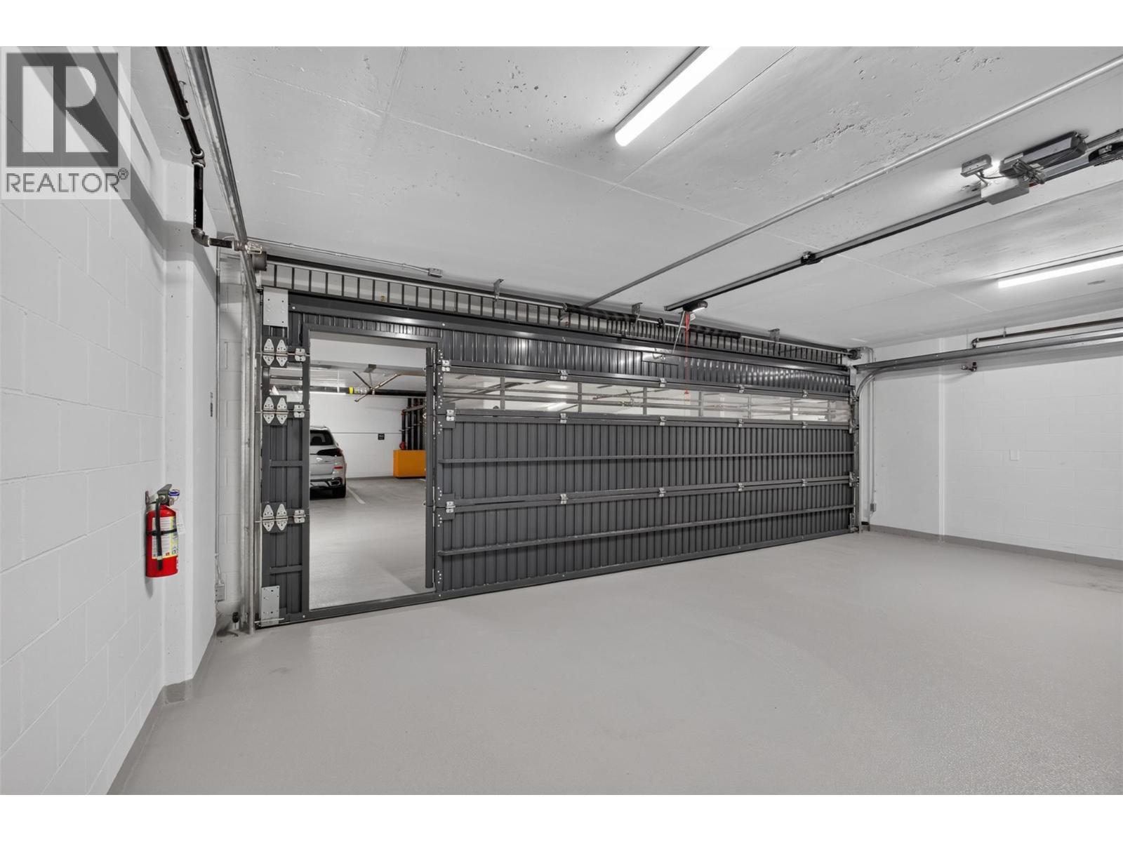 Man-door for additional access convenience - 3800 Capozzi Road Unit# Ph2, Kelowna, BC - Indoor Photo Showing Garage