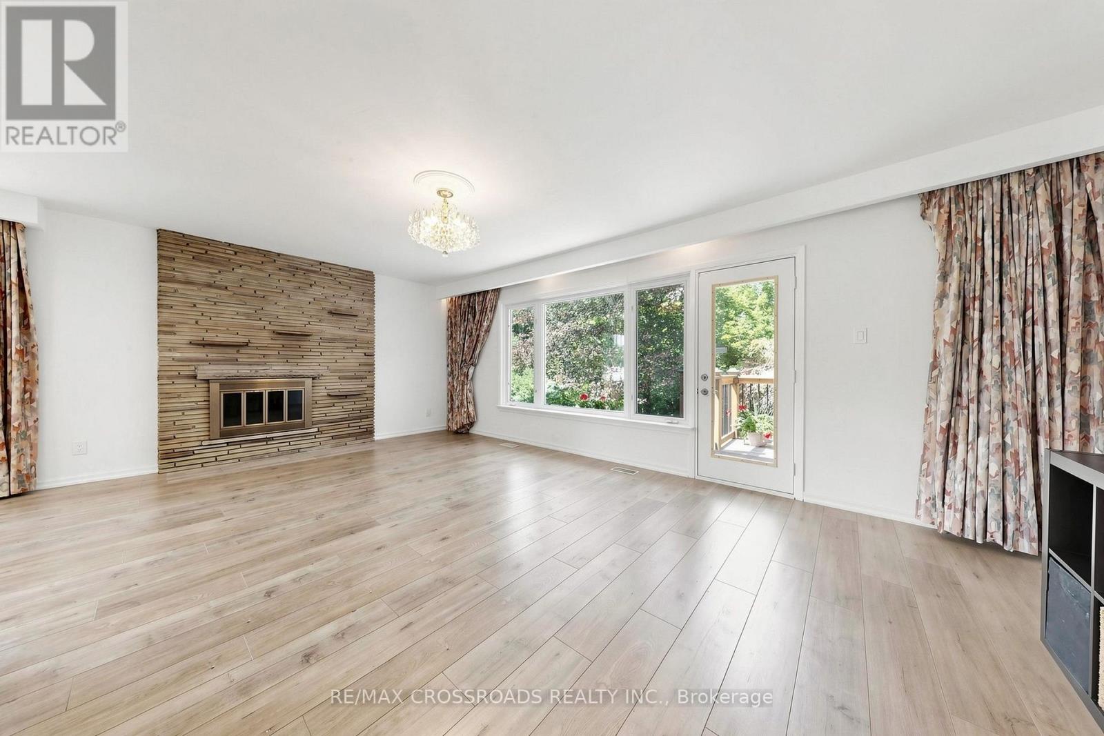 15 Alamosa Drive, Toronto, ON - Indoor Photo Showing Living Room With Fireplace