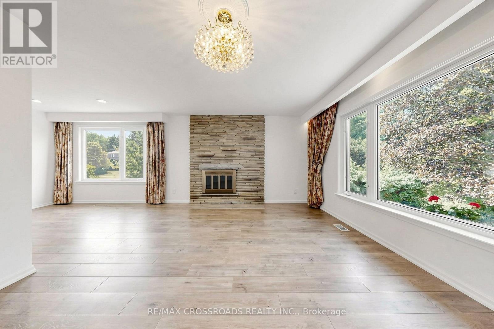 15 Alamosa Drive, Toronto, ON - Indoor Photo Showing Living Room With Fireplace