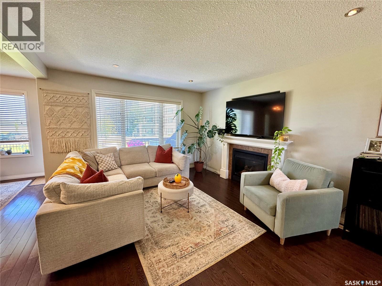 18 1600 Muzzy Drive, Prince Albert, SK - Indoor Photo Showing Living Room With Fireplace