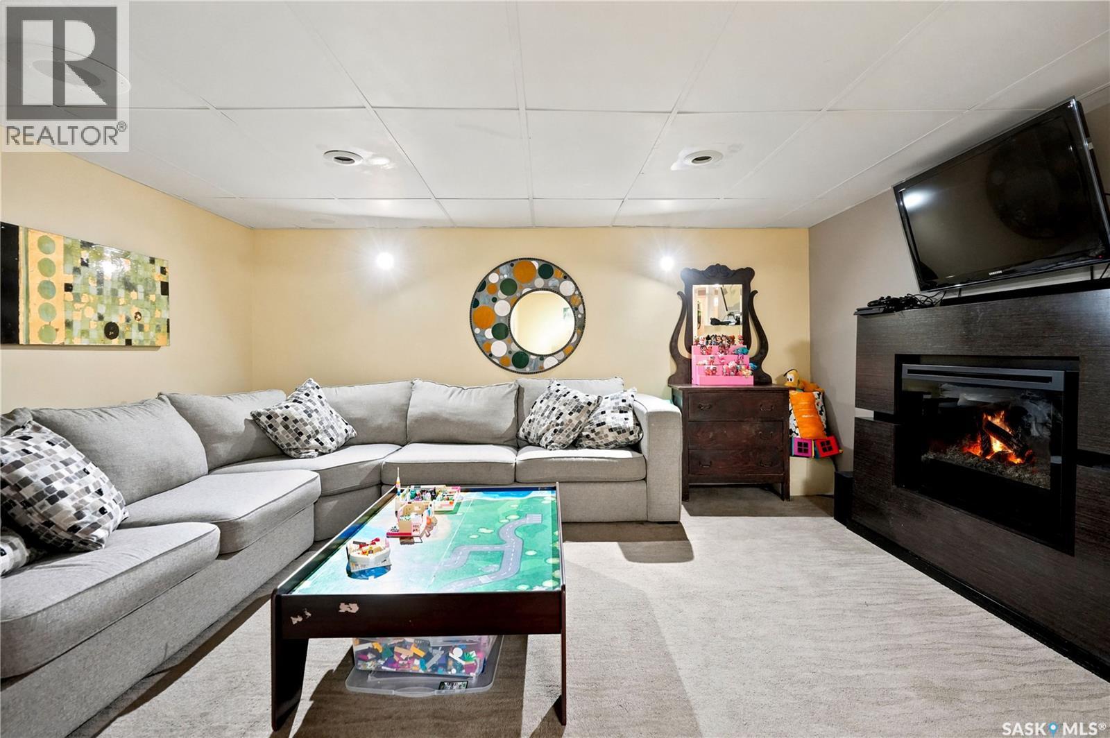 111 Minot Drive, Regina, SK - Indoor Photo Showing Living Room With Fireplace