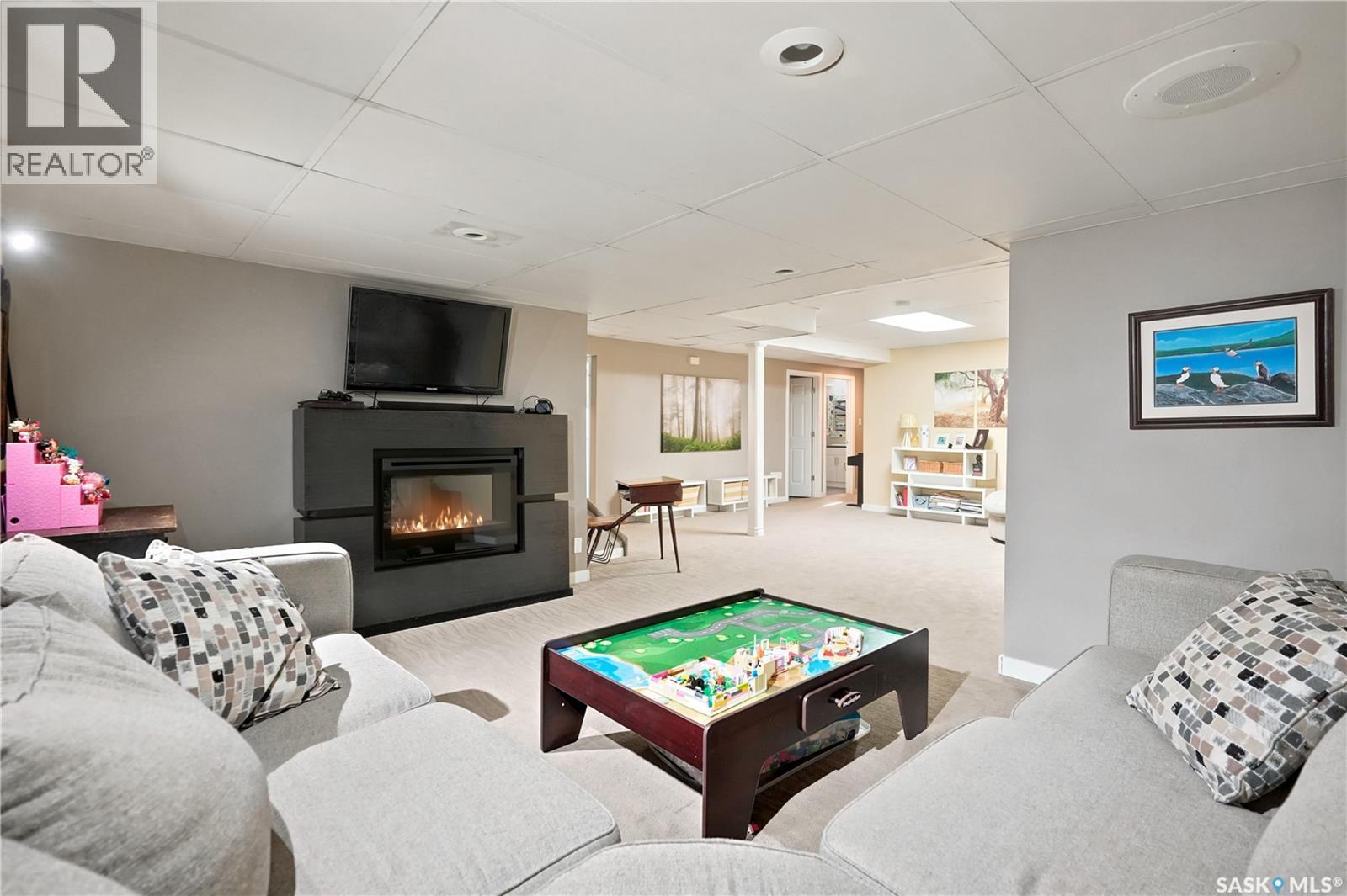 111 Minot Drive, Regina, SK - Indoor Photo Showing Other Room With Fireplace