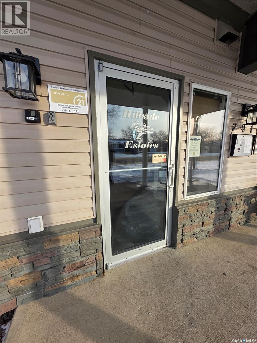 205 701 Henry Street, Estevan, SK - Outdoor With Deck Patio Veranda With Exterior