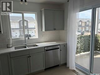 35 4850 Harbour Landing Drive, Regina, SK - Indoor Photo Showing Kitchen With Double Sink