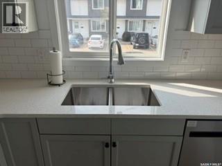 35 4850 Harbour Landing Drive, Regina, SK - Indoor Photo Showing Kitchen With Double Sink