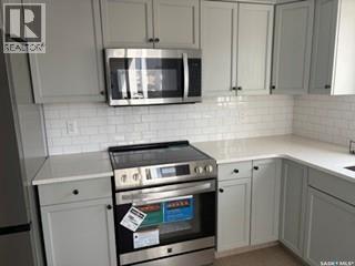 35 4850 Harbour Landing Drive, Regina, SK - Indoor Photo Showing Kitchen