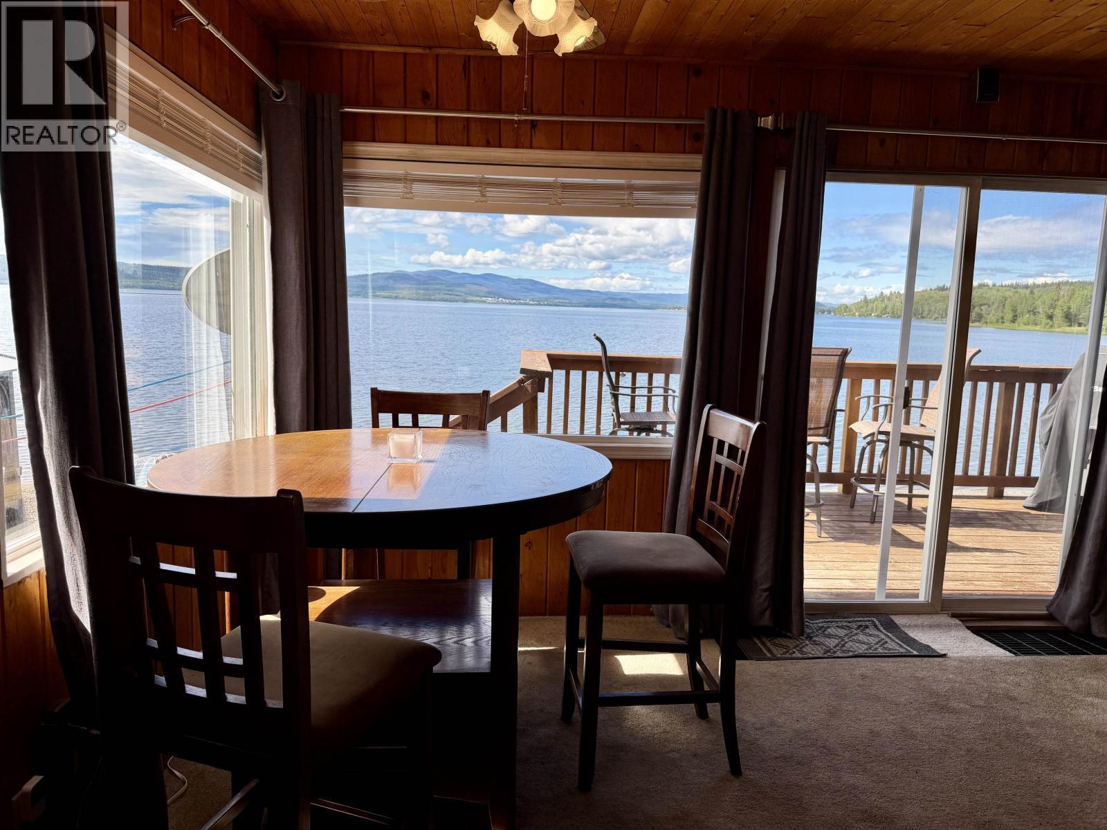 23397 Stella Road, Fraser Lake, BC - Indoor Photo Showing Dining Room With Body Of Water