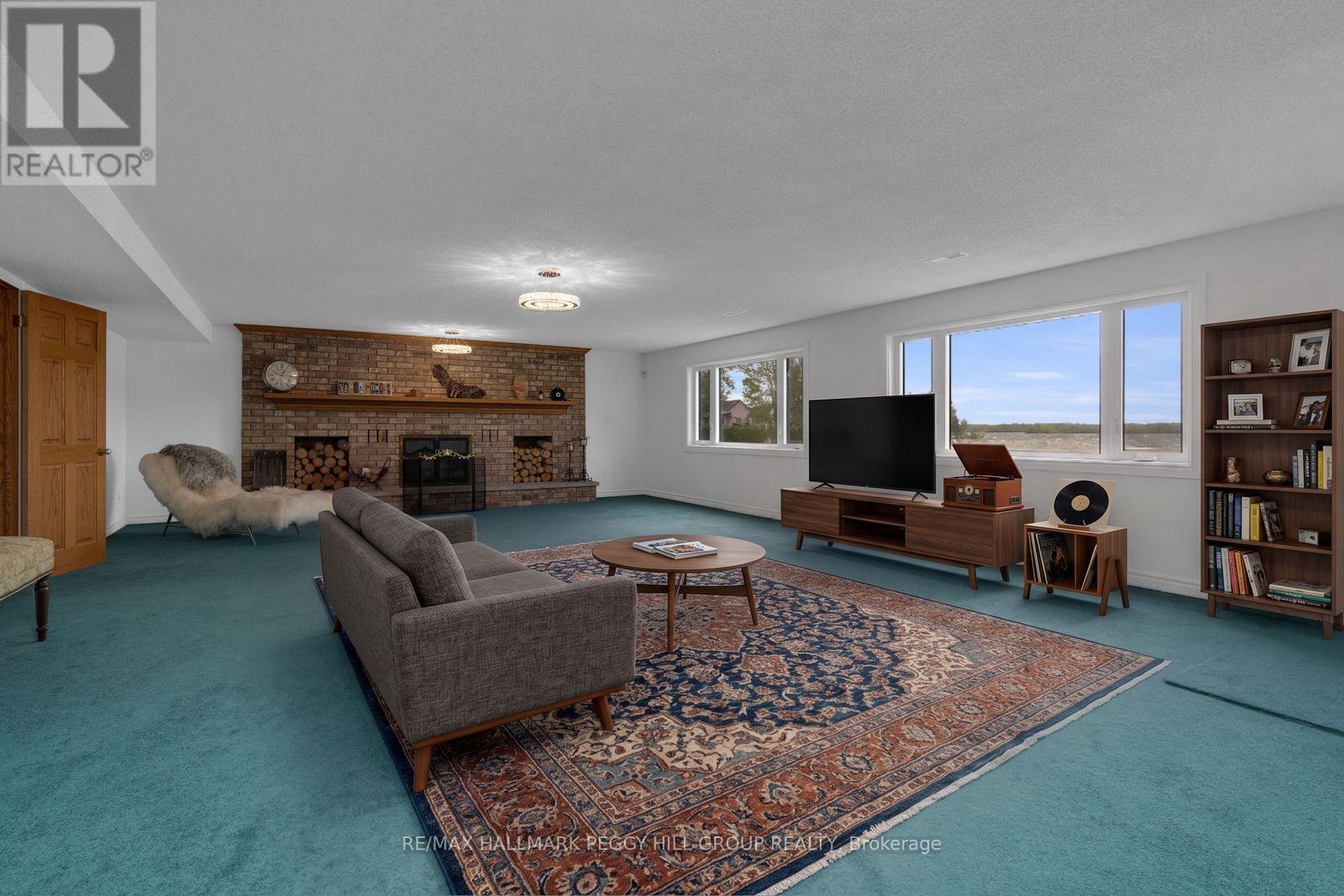 3686 Portage Bay Road, Ramara, ON - Indoor Photo Showing Living Room With Fireplace