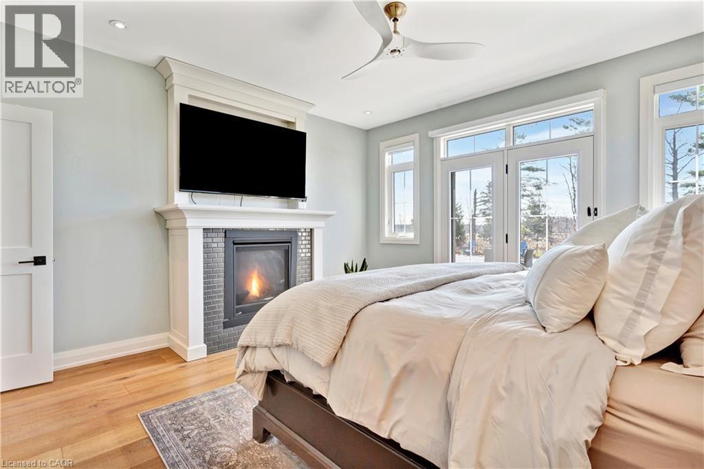 42 Parsonage Road, Ancaster, ON - Indoor Photo Showing Bedroom With Fireplace