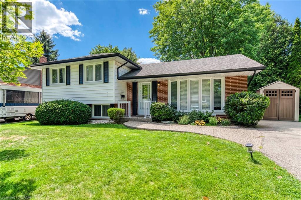 Split-level residence featuring a brick and white siding facade with black shutters - 356 Dunlop Crescent, Burlington, ON - Outdoor With Facade