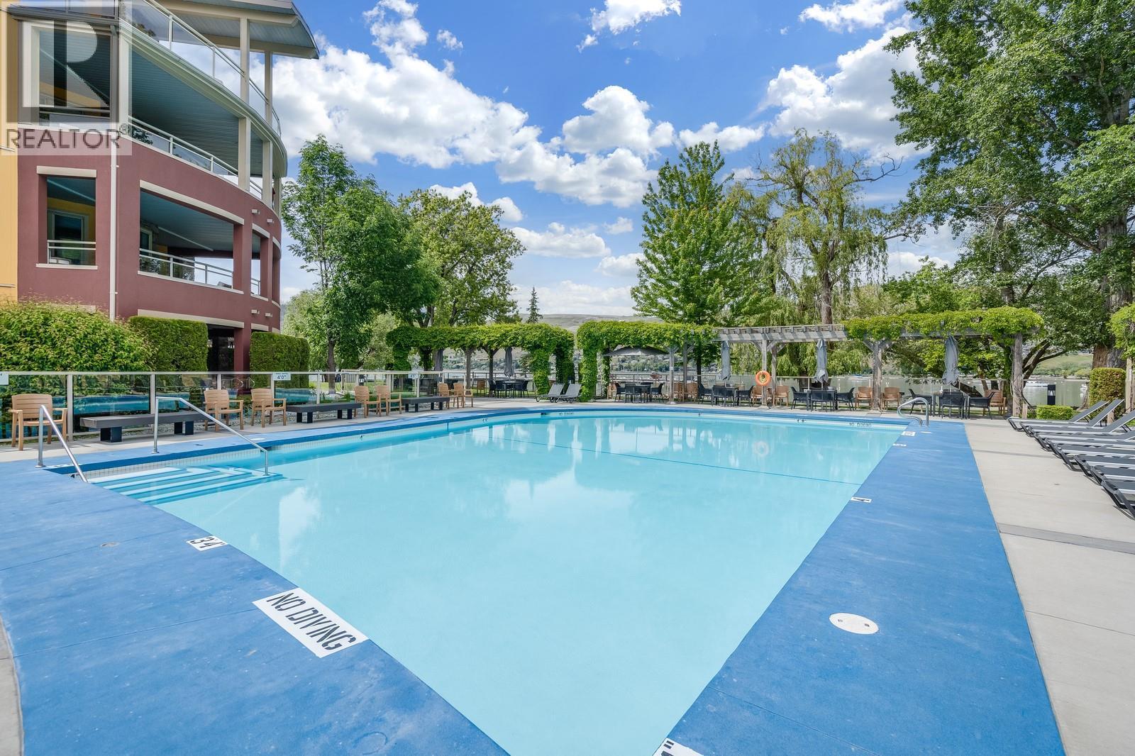 Enjoy A Heated Outdoor Pool And Year-Round Hot Tub - 7343 Okanagan Landing Road Unit# 2402, Vernon, BC - Outdoor With In Ground Pool