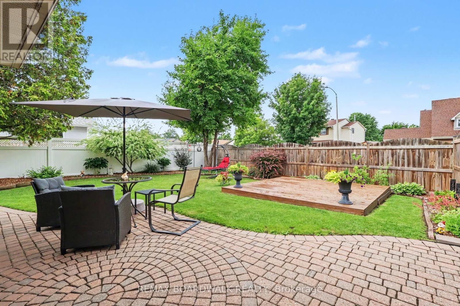 Beautifully Landscaped Backyard - 329 Pintail Terrace, Ottawa, ON - Outdoor With Deck Patio Veranda With Backyard