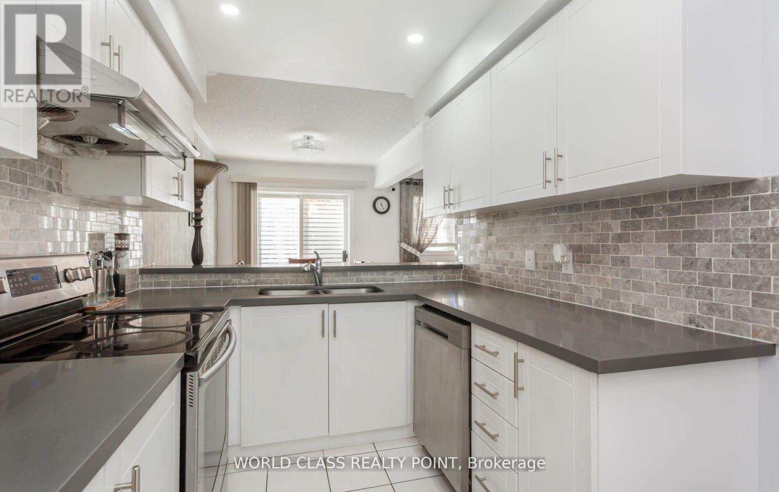 17 Manett Crescent E, Brampton, ON - Indoor Photo Showing Kitchen With Double Sink