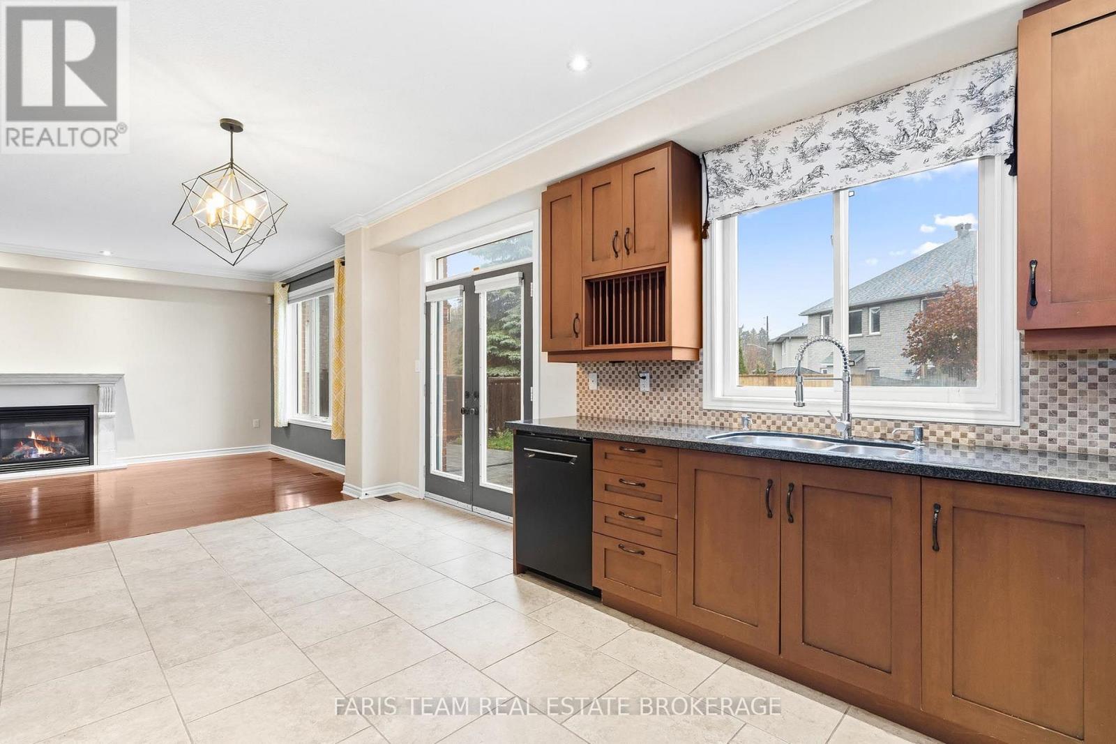 3 Prince William Way, Barrie, ON - Indoor Photo Showing Kitchen With Fireplace With Double Sink