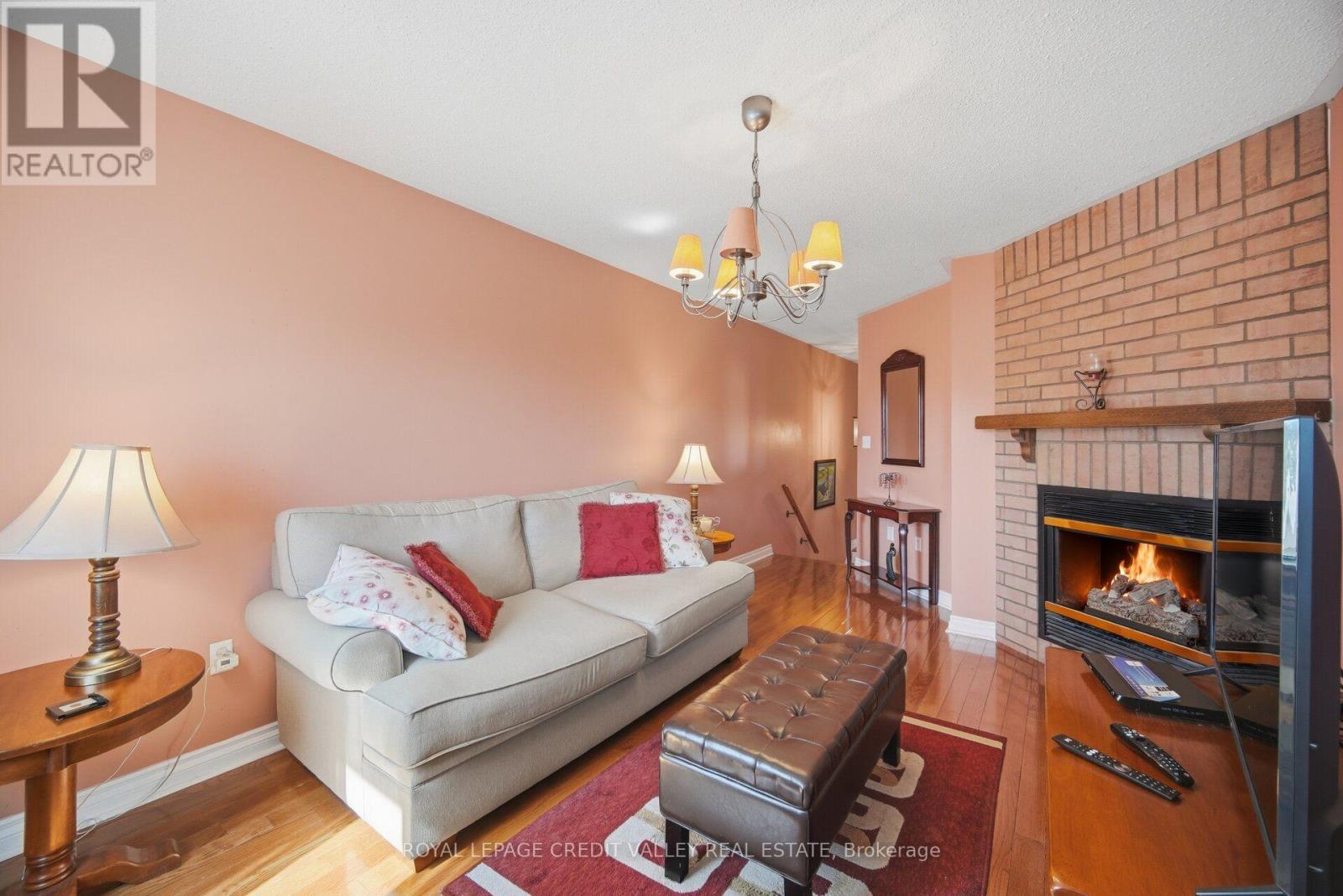 8 Pressed Brick Drive, Brampton, ON - Indoor Photo Showing Living Room With Fireplace