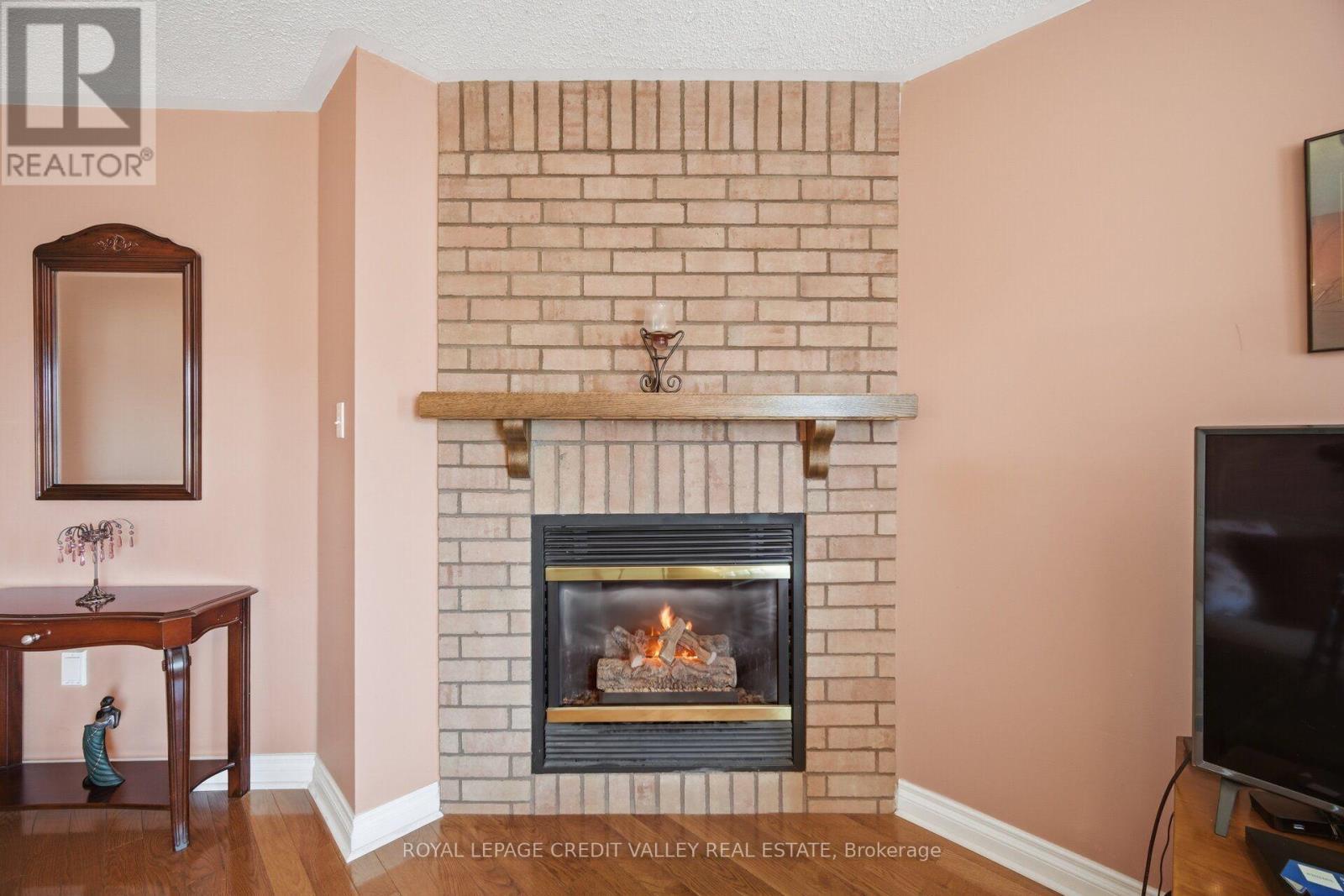 8 Pressed Brick Drive, Brampton, ON - Indoor Photo Showing Living Room With Fireplace