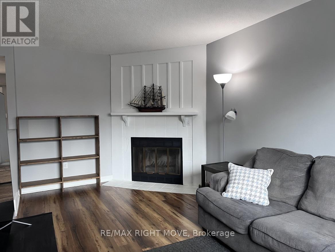 AI Enhanced - 3 - 486 Springbank Avenue N, Woodstock, ON - Indoor Photo Showing Living Room With Fireplace