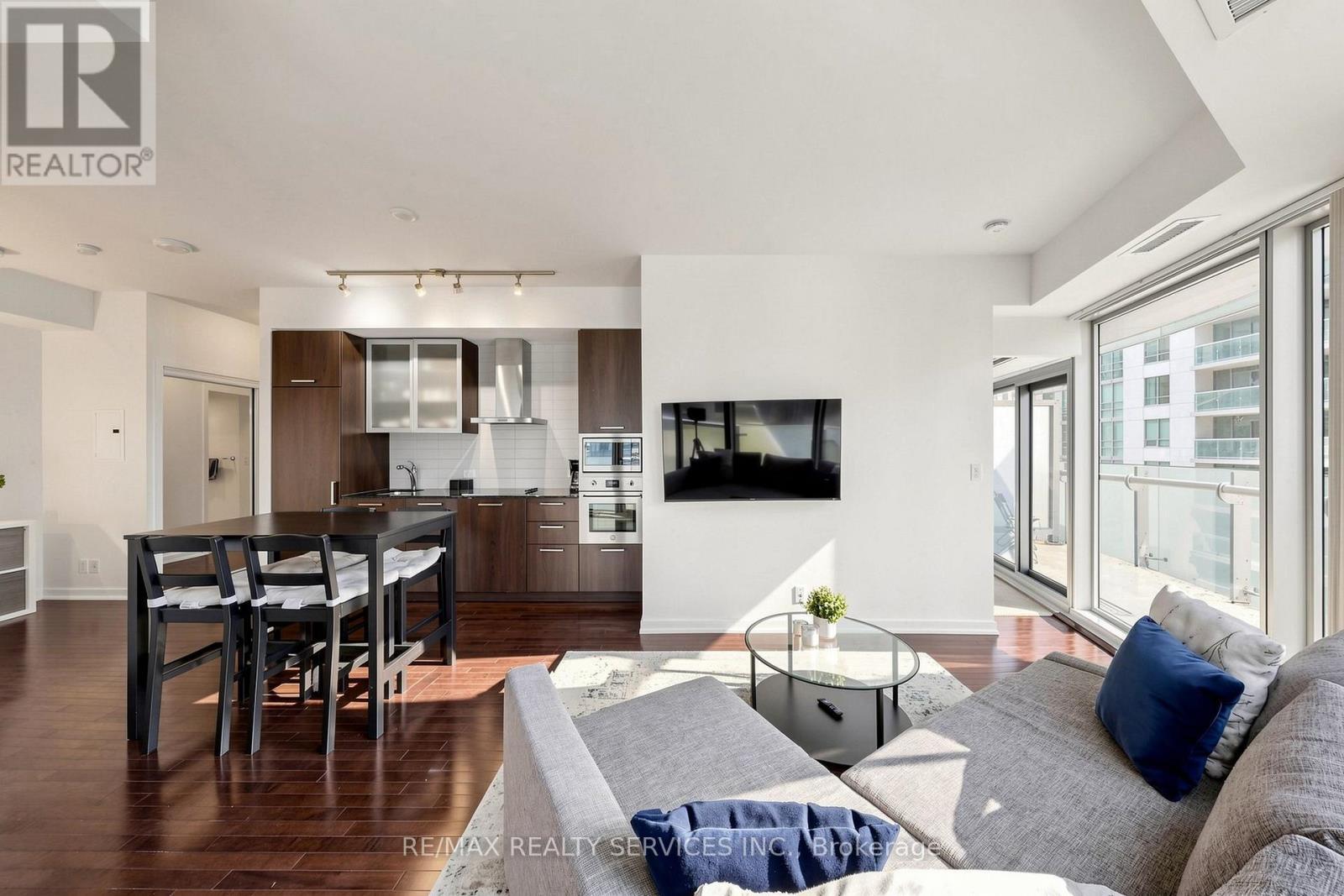 407 - 12 York Street, Toronto, ON - Indoor Photo Showing Living Room With Fireplace