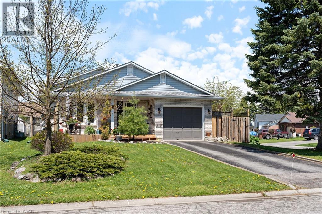 Ranch-style exterior featuring light-colored brick and horizontal siding - 2 Hampton Court, Port Dover, ON - Outdoor