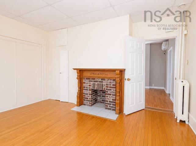 18/20 Queen Street, Sydney, NS - Indoor With Fireplace