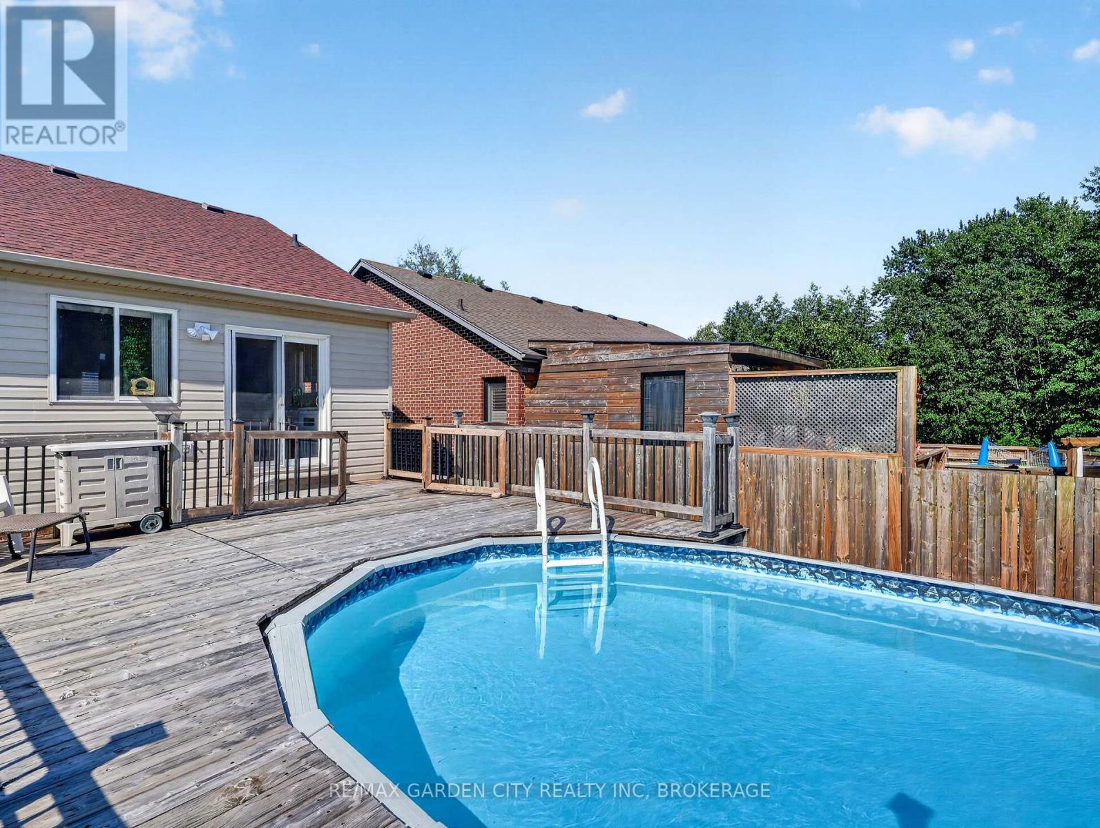 828 Foss Road, Pelham (Fenwick), ON - Outdoor With Above Ground Pool With Deck Patio Veranda
